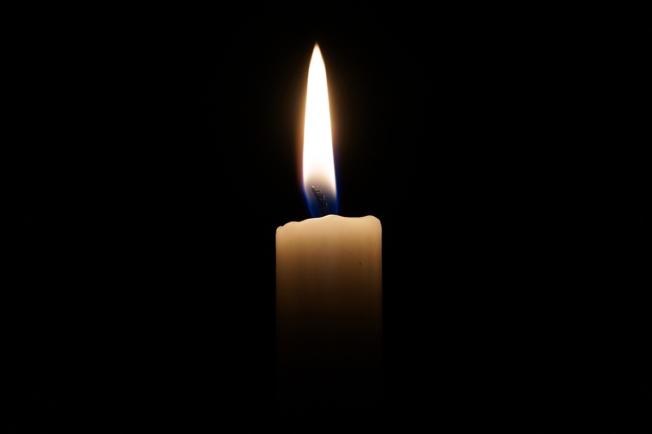 Close-up of a candle flame against a black background